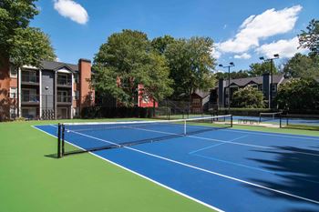 tennis court at the bradley braddock road station apartments at Elme Druid Hills, Atlanta